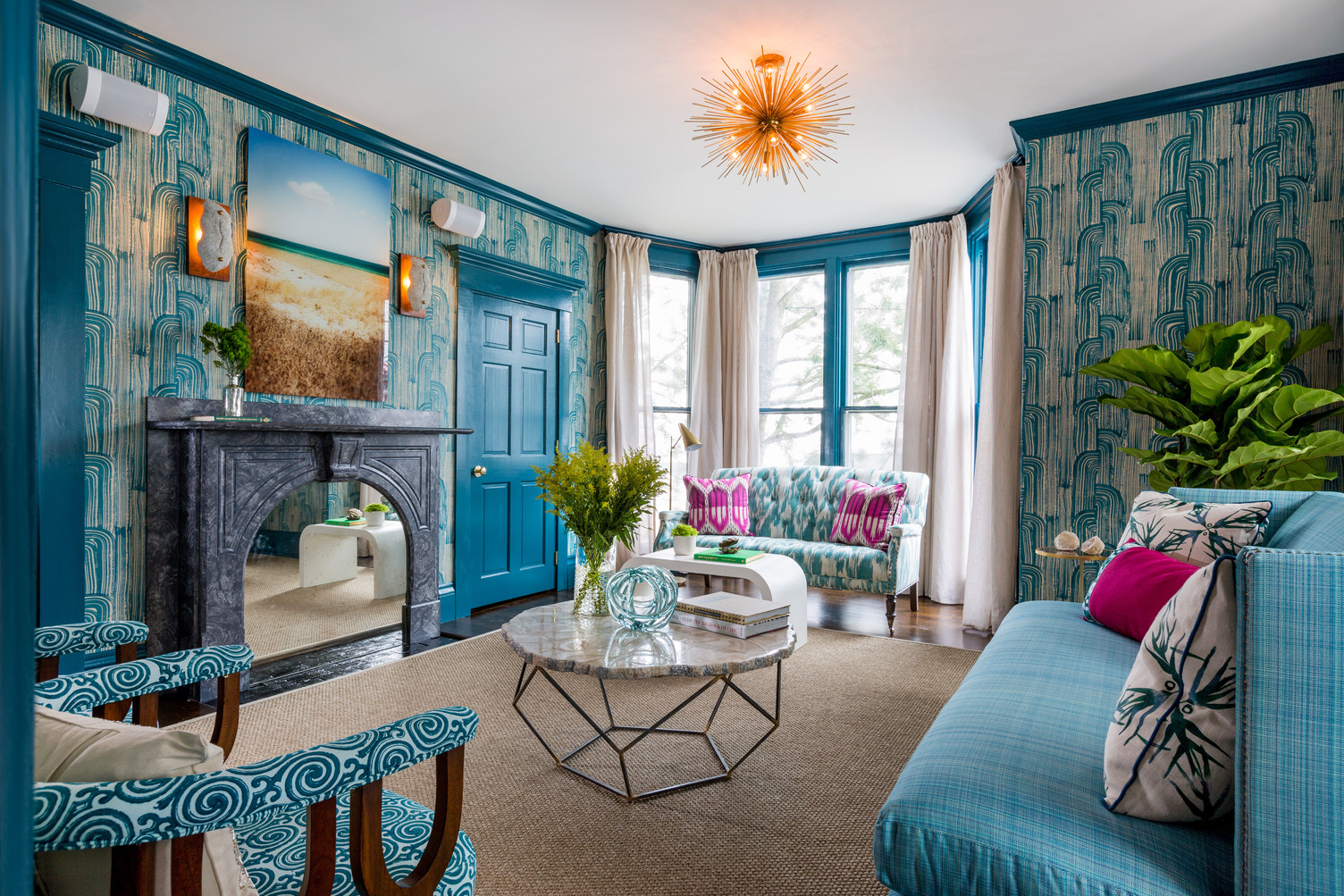 Lounge area with large windows and comfy seating at The Christopher