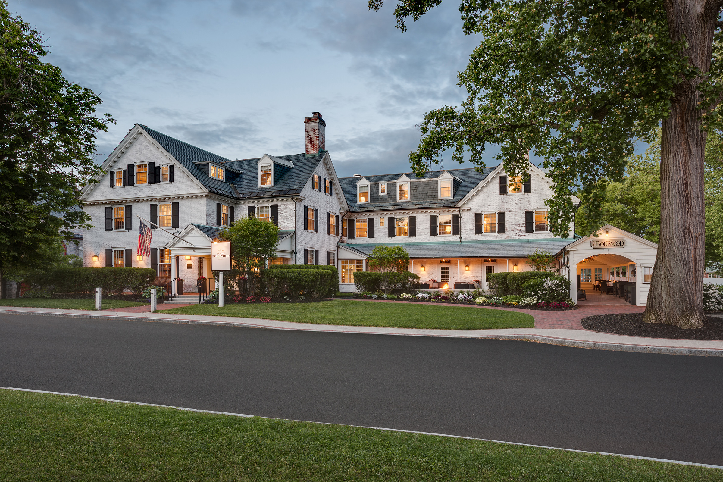 Inn on Boltwood exterior view with lights on from across the street